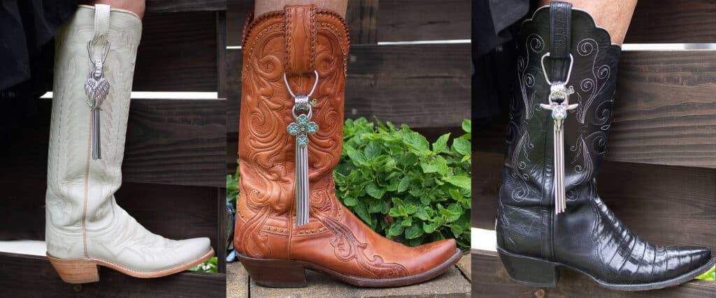 A large decorative key hanging on a brown cowboy boot.